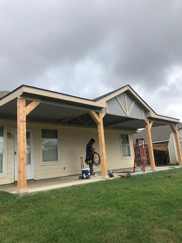 Cedar post patio cover with a gable end going up on a DFW home