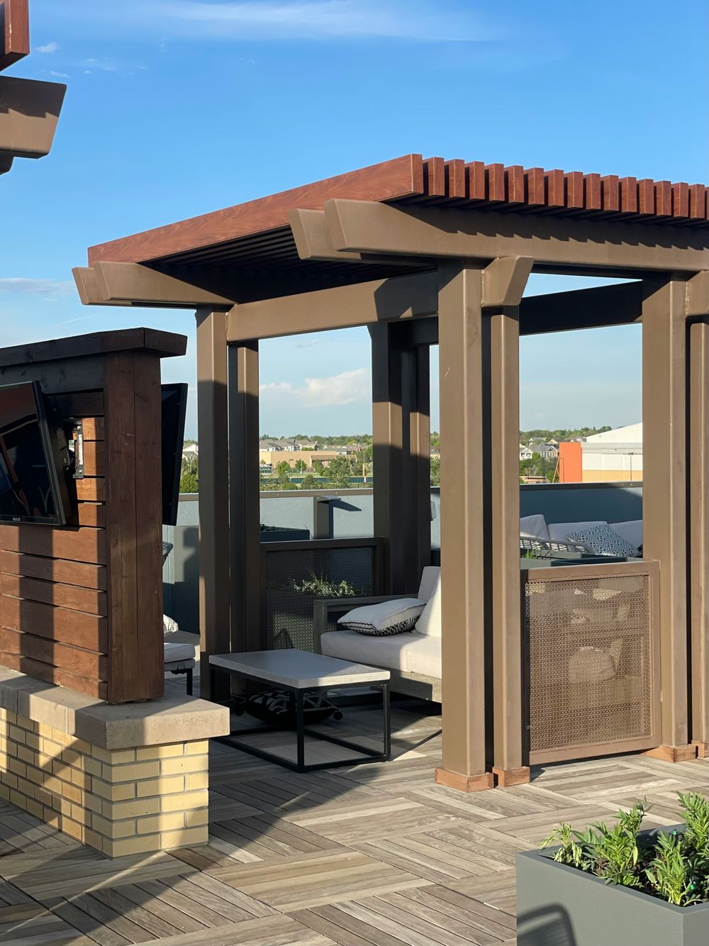 Modern slat-roof pergola on a rooftop deck